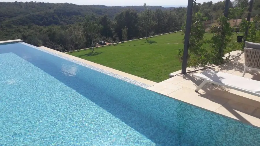 Lawn beside a pool overlooking the countryside
